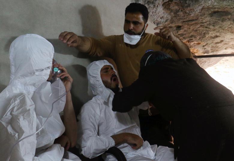 a man breathes through an oxygen mask as another one receives treatments after what rescue workers described as a suspected gas attack in the town of khan sheikhoun in rebel held idlib syria april 4 2017 photo reuters