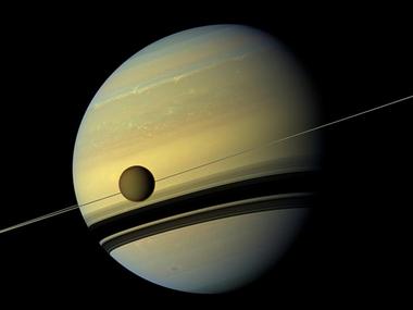 titan saturn 039 s largest moon appears before the planet as it undergoes seasonal changes in this natural color view from nasa 039 s cassini spacecraft in this handout released by nasa august 29 2012 photo reuters