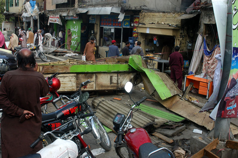 brought down shopkeepers look around helplessly at the rubble that was once their shops photo waseem nazir express