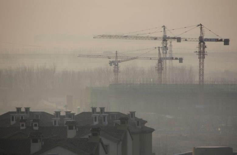 apartment blocks are pictured next to a construction site on a hazy day in wuqing district of tianjin china photo reuters