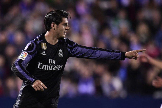 real madrid 039 s forward alvaro morata celebrates after scoring their third goal during the spanish league football match club deportivo leganes sad vs real madrid cf at the estadio municipal butarque in leganes on the outskirts of madrid on april 5 2017 photo afp real madrid 039 s forward alvaro morata celebrates after scoring their third goal during the spanish league football match club deportivo leganes sad vs real madrid cf at the estadio municipal butarque in leganes on the outskirts of madrid on april 5 2017 photo afp