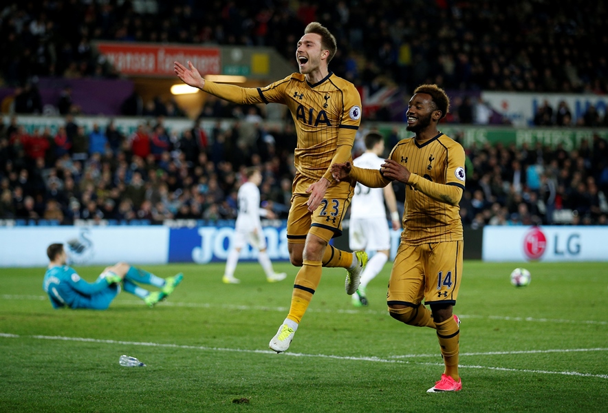 tottenham 039 s christian eriksen celebrates scoring their third goal with georges kevin nkoudou as swansea city 039 s lukasz fabianski looks dejected in the match on april 5 2016 photo reuters