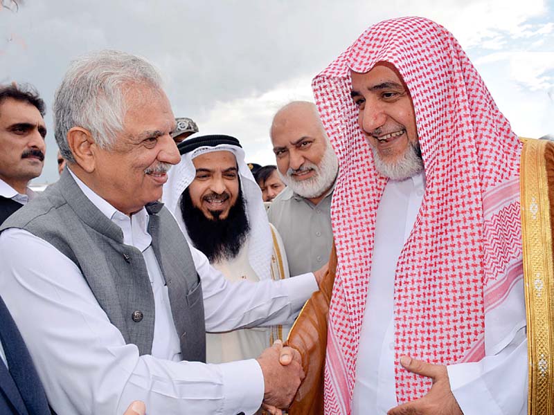 khyber pakhtunkhwa governor iqbal jhagra welcomes imam e kaa ba at the peshawar airport photo ppi