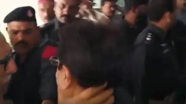 pti leader got into a scuffle with police officials deployed outside the cbc office an express news screengrab