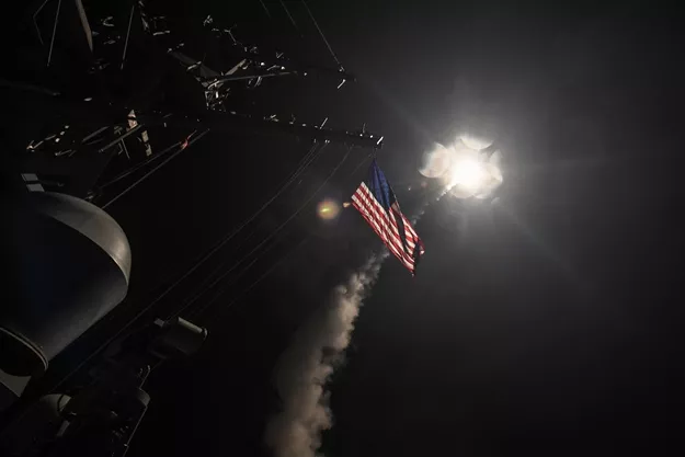 in this image released by the us navy the uss ross fires a tomahawk land attack missile april 7 2017 at a syrian air force airfield photo afp in this image released by the us navy the uss ross fires a tomahawk land attack missile april 7 2017 at a syrian air force airfield photo afp