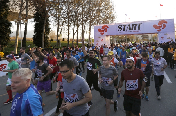local and foreign participants attend the first international tehran marathon at azadi square in tehran photo afp