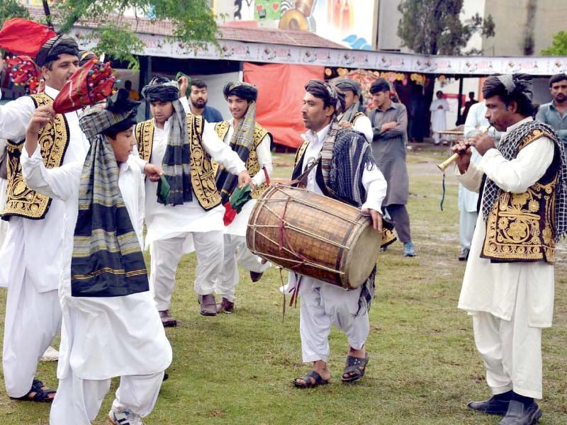 traditional folk dancers perform in the lok mela photo online