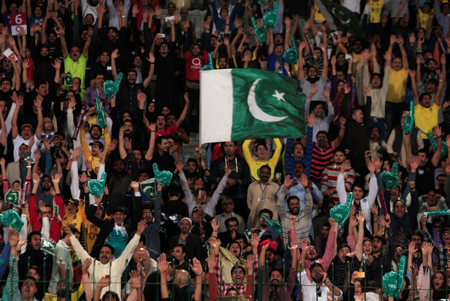 pakistani spectators cheer during the final psl at the gaddafi cricket stadium in lahore photo reuters