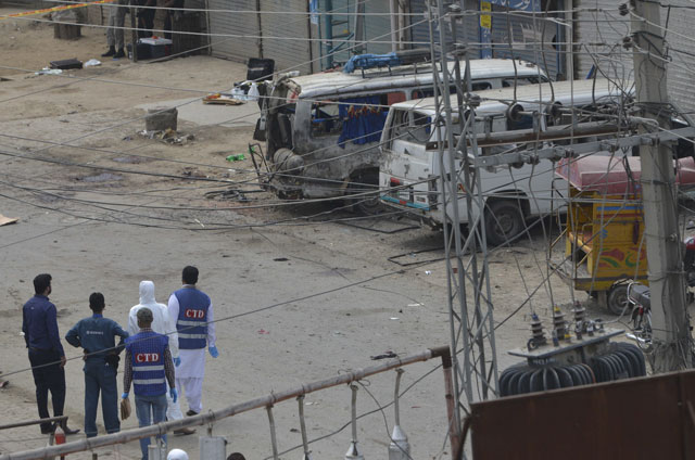 a forensic team arrives at the scene of a suicide bomb attack on a census team in lahore on april 5 2017 photo afp