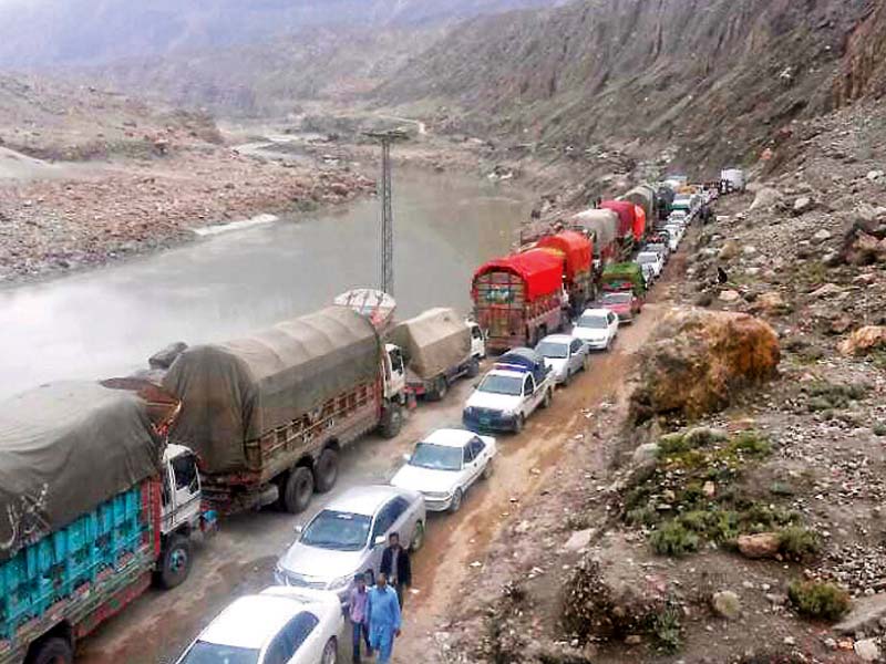 a view of the long line of vehicles on karakoram highway in chilas photo online