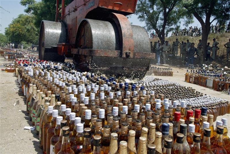 a roller crushes liquor bottles at koba village about 18 km 12 miles north from the western indian city of ahmedabad march 28 2006 the state prohibition department of western indian state of gujarat disposed of 22 000 seized bottles of liquor an official said on tuesday reuters amit dave