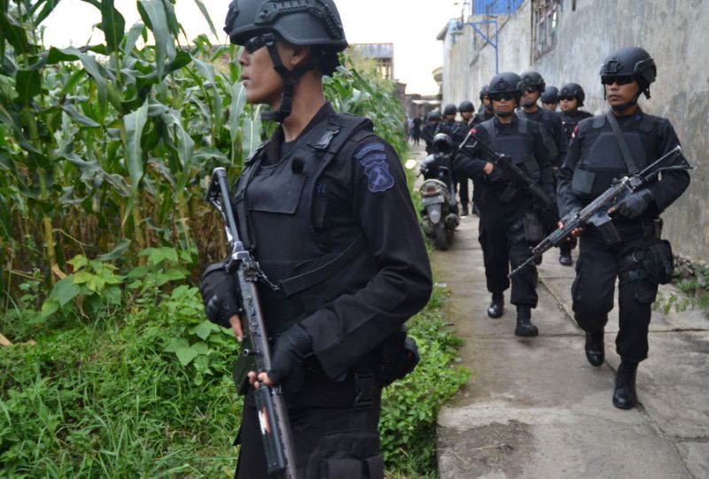 indonesian police personnel patrol during a raid photo afp