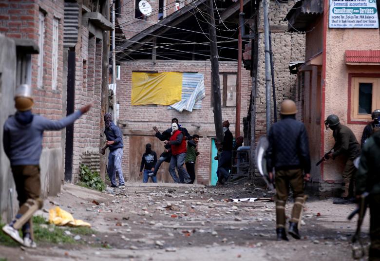 kashmiri demonstrators c throw stones towards indian policemen during a protest against by polls in srinagar april 9 2017 photo reuters