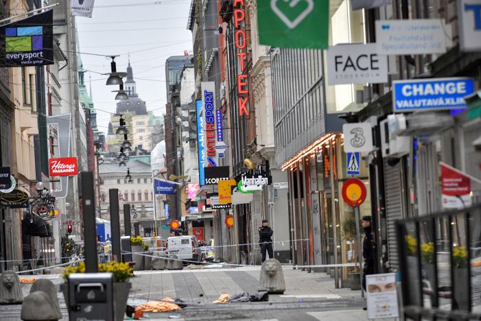 police cordon in central stockholm the morning after a hijacked beer truck plowed into pedestrians on drottninggatan and crashed into ahlens department store on friday killing four people injuring 15 others photo reuters