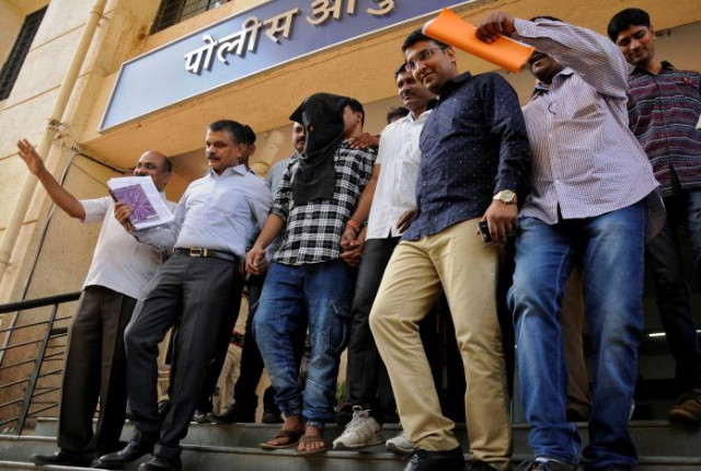 police officials escort sagar thakkar the suspected mastermind in the internal revenue service irs call center scams to a police station in thane on the outskirts of mumbai india april 8 2017 photo reuters police officials escort sagar thakkar the suspected mastermind in the internal revenue service irs call center scams to a police station in thane on the outskirts of mumbai india april 8 2017 photo reuters