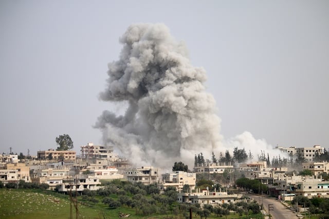 smoke billows following a reported air strike on a rebel held area in the southern syrian city of daraa on april 8 2017 photo afp