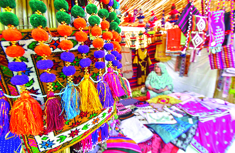 stalls of traditional jewellery bags vases and other items representing all four provinces and g b and kashmir were set up in the craft bazaar photos online
