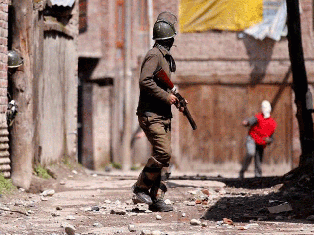 a kashmiri demonstrator r throws a stone towards an indian policeman during a protest against by polls in srinagar april 9 2017 photo reuters a kashmiri demonstrator r throws a stone towards an indian policeman during a protest against by polls in srinagar april 9 2017 photo reuters
