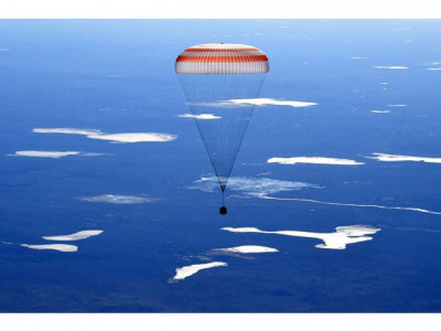 two russians one american land back on earth