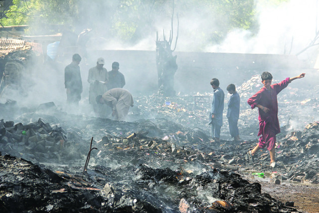 reduced to cinders the blaze was declared a third degree fire and a thick cloud of smoke emanating could be seen from a distance photo ayesha mir express reduced to cinders the blaze was declared a third degree fire and a thick cloud of smoke emanating could be seen from a distance photo ayesha mir express