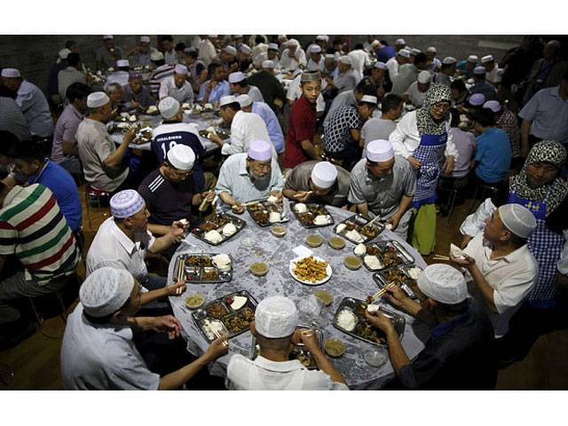 muslims eat meals as they break fast on the first day of the holy fasting month of ramadan at the niujie mosque in beijing photo reuters