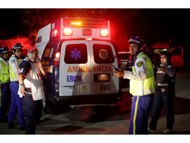 members of the red cross and police officers are seen inside a building after a structural collapse in a car park under construction in mexico city mexico april 10 2017 photo reuters