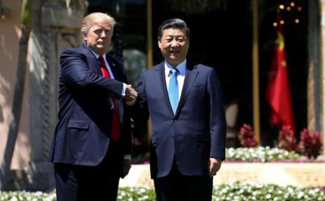 u s president donald trump l and china 039 s president xi jinping shake hands while walking at mar a lago estate after a bilateral meeting in palm beach florida u s april 7 2017 photo reuters