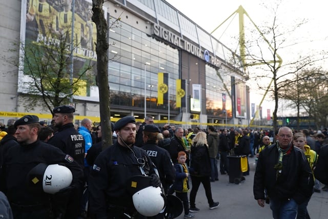 police patrol outide the stadium after the team bus of borussia dortmund had some windows broken by an explosion some 10km away from the stadium prior to the uefa champions league 1st leg quarter final football match bvb borussia dortmund v monaco in dortmund western germany on april 11 2017 photo afp