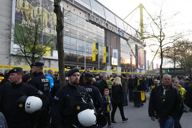 police patrol outide the stadium after the team bus of borussia dortmund had some windows broken by an explosion some 10km away from the stadium prior to the uefa champions league 1st leg quarter final football match bvb borussia dortmund v monaco in dortmund western germany on april 11 2017 photo afp police patrol outide the stadium after the team bus of borussia dortmund had some windows broken by an explosion some 10km away from the stadium prior to the uefa champions league 1st leg quarter final football match bvb borussia dortmund v monaco in dortmund western germany on april 11 2017 photo afp