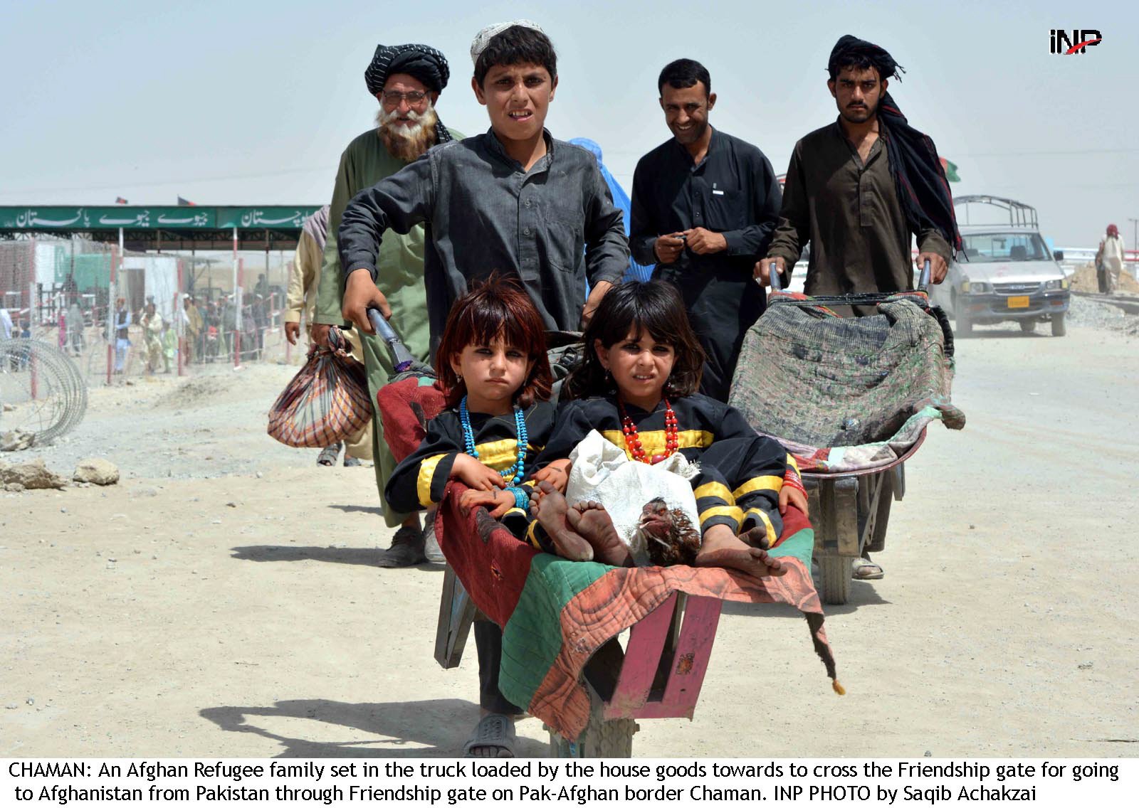 afghan refugees can be seen returning to their homes with what little belongings they have photo inp