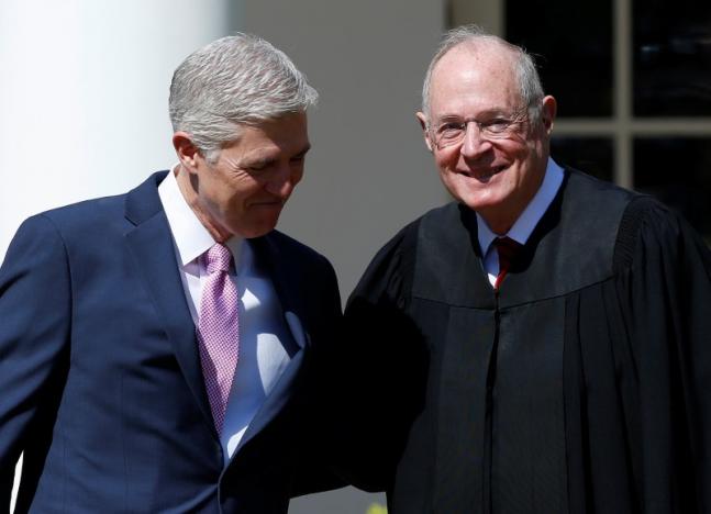 judge neil gorsuch greets justice anthony kennedy before being sworn in as an associate supreme court justice in the rose garden of the white house in washington u s april 10 2017 photo reuters