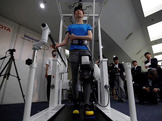 a model demonstrates toyota motor corp 039 s rehabilitation robot welwalk ww 1000 designed to aid in the rehabilitation of individuals with lower limb paralysis in tokyo japan april 12 2017 photo reuters