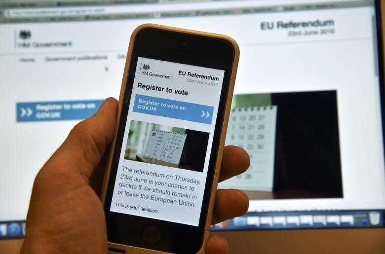 a web page on a voting registration site for the forthcoming british eu referendum is seen on a laptop computer and a smart phone in london britain june 8 2016 photo reuters