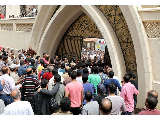 egyptians gather in front of a coptic church that was bombed on sunday april 9 in tanta egypt photo reuters