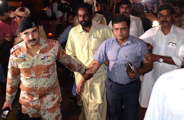 rangers personnel escort muttahida qaumi movement leader amjadullah khan to a local court in karachi photo express file