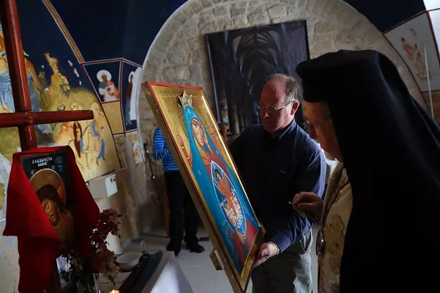 archbishop joseph jules zerey r of the melkite greek catholic church blesses foreign students of the bethlehem icon center as they present the works executed during their course in the biblical west bank city of bethlehem on april 11 2017 photo afp archbishop joseph jules zerey r of the melkite greek catholic church blesses foreign students of the bethlehem icon center as they present the works executed during their course in the biblical west bank city of bethlehem on april 11 2017 photo afp