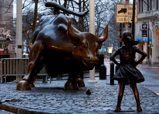 file photo a statue of a girl facing the wall st bull is seen as part of a campaign by u s fund manager state street to push companies to put women on their boards in the financial district in new york us photo reuters