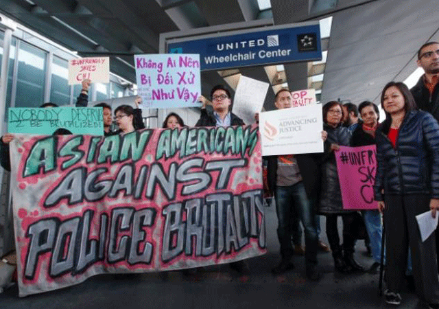 community members protest the treatment of dr david dao who was forcibly removed from a united airlines flight on sunday by the chicago aviation police at o 039 hare international airport in chicago illinois us april 11 2017 photo reuters