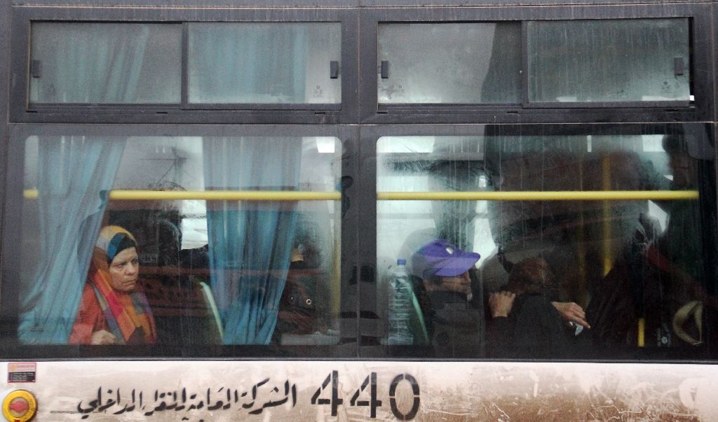 syrians aboard a bus from government held fuaa and kafraya arrive in rebel held rashidin west of aleppo city as part of an evacuation deal syrians aboard a bus from government held fuaa and kafraya arrive in rebel held rashidin west of aleppo city as part of an evacuation deal photo afp