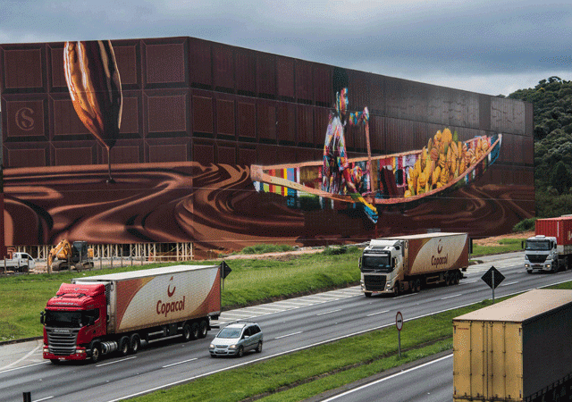 view of the biggest mural in the world with 5 742 square metres by brazilian mural artist eduardo kobra in itapevi metropolitan area of sao paulo brazil on april 12 2017 photo afp view of the biggest mural in the world with 5 742 square metres by brazilian mural artist eduardo kobra in itapevi metropolitan area of sao paulo brazil on april 12 2017 photo afp