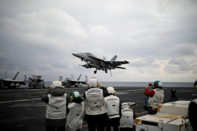file photo a u s f18 fighter jet lands on the deck of u s aircraft carrier uss carl vinson during an annual joint military exercise called quot foal eagle quot between south korea and u s in the east sea south korea photo reuters file photo a u s f18 fighter jet lands on the deck of u s aircraft carrier uss carl vinson during an annual joint military exercise called quot foal eagle quot between south korea and u s in the east sea south korea photo reuters