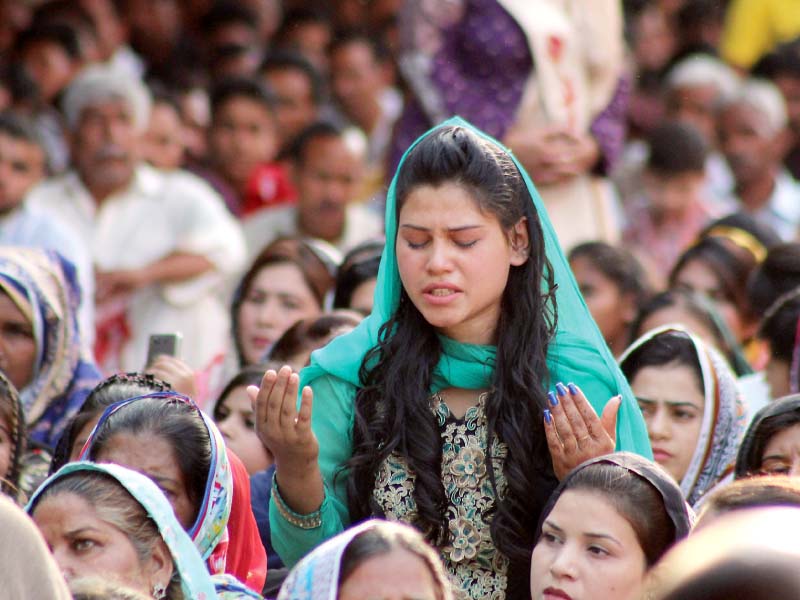 a woman takes part in prayers on good friday at the don bosco church on empress road lahore special prayers started at noon and ended at 3pm photo abid nawaz express