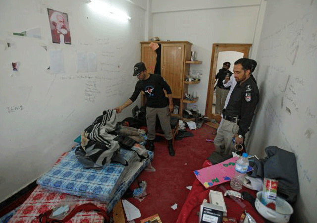 police search the dorm room of mashal khan accused of blasphemy who was killed by a mob at abdul wali khan university in mardan pakistan april 14 2017 photo reuters