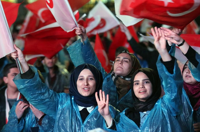 supporters of turkey 039 s president celebrate during a rally near the headquarters of the conservative justice and development party akp on april 16 2017 in ankara photo afp