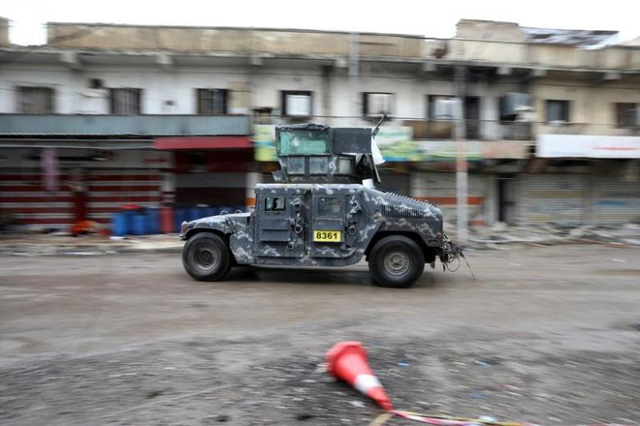 a vehicle of the iraqi forces drives along a street controlled by the iraqi federal police during combat with islamic state in western mosul iraq april 14 2017 photo reuters