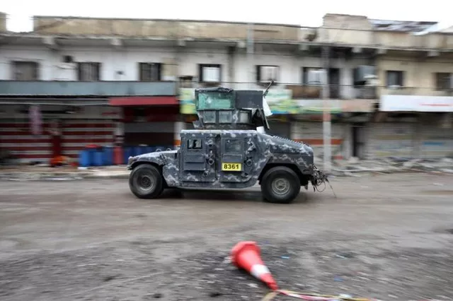 a vehicle of the iraqi forces drives along a street controlled by the iraqi federal police during combat with islamic state in western mosul iraq april 14 2017 photo reuters a vehicle of the iraqi forces drives along a street controlled by the iraqi federal police during combat with islamic state in western mosul iraq april 14 2017 photo reuters