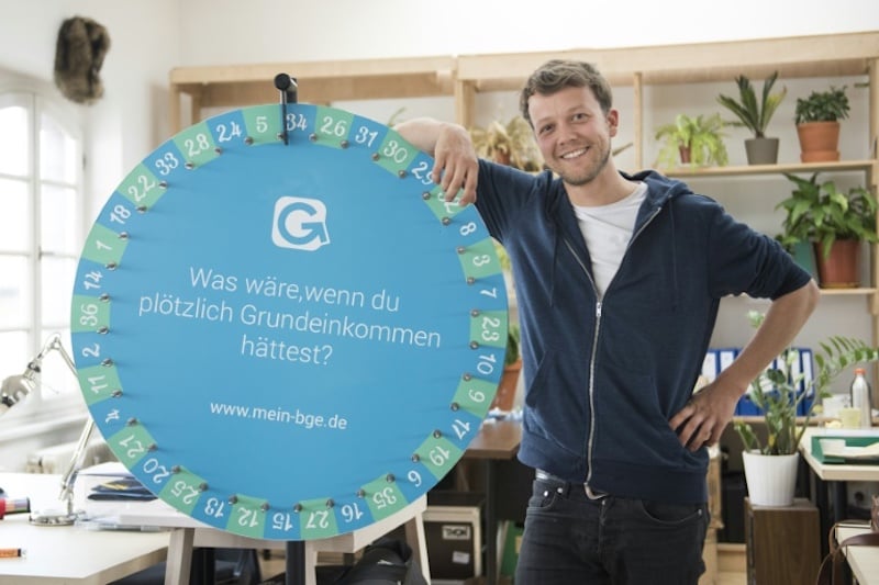 michael bohmeyer founder of startup mein grundeinkommen my basic income which raffles an unconditional basic income poses for a photo at his office in berlin on april 13 2017 photo afp