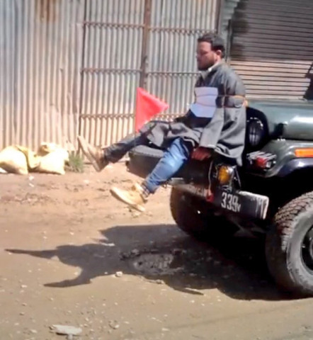 videograb shows a kashmiri youth being tied to an indian army jeep in held kashmir photo twitter videograb shows a kashmiri youth being tied to an indian army jeep in held kashmir photo twitter