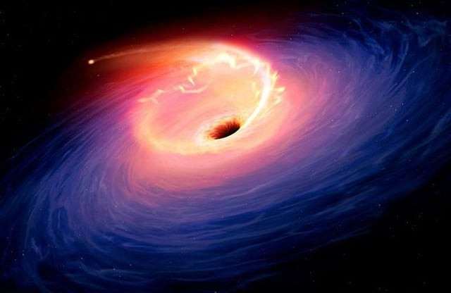 theoretical astronomy tells us that when a black hole absorbs matter a brief flash of light is visible as depicted in this artist 039 s rendering photo afp