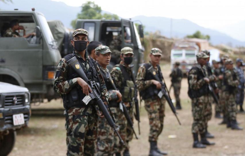 soldiers guard supply trucks after local people forced an army truck carrying relief supplies off the road saying they have not received any government food aid five days after saturday 039 s earthquake near chautara nepal photo reuters